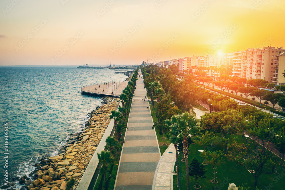 Obraz premium Molos Promenade on Limassol City coast in Cyprus at Sunset, Aerial View from Drone.