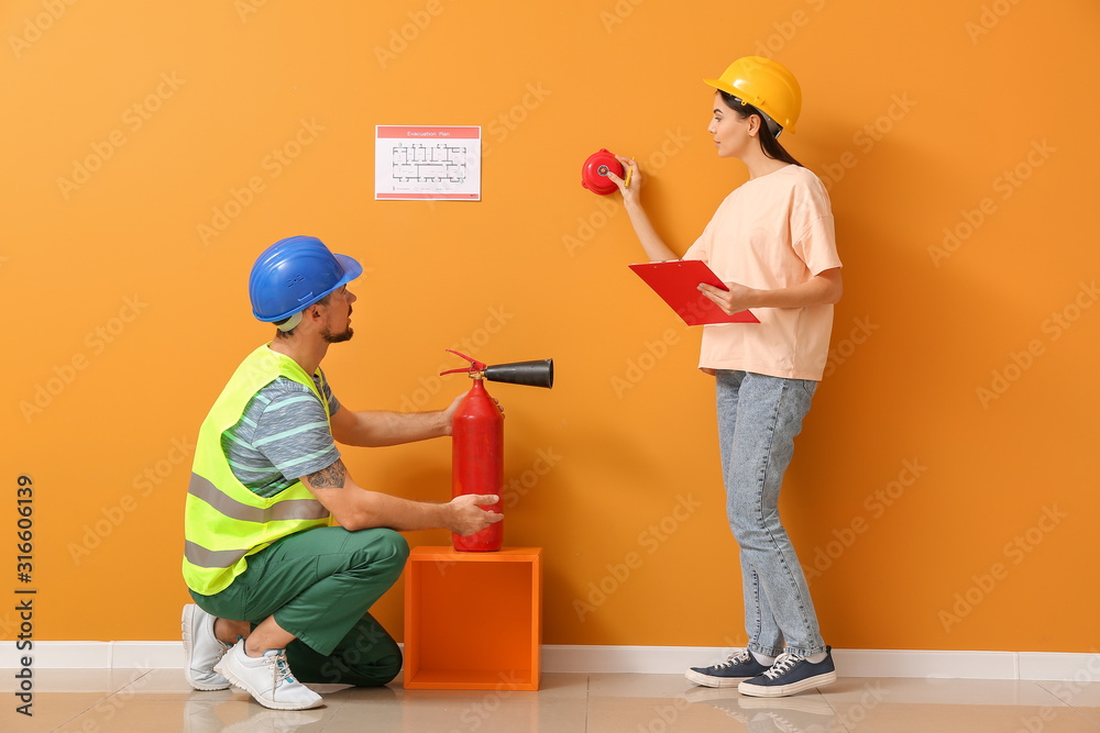 Fire safety specialists inspecting building Fire safety specialists inspecting building