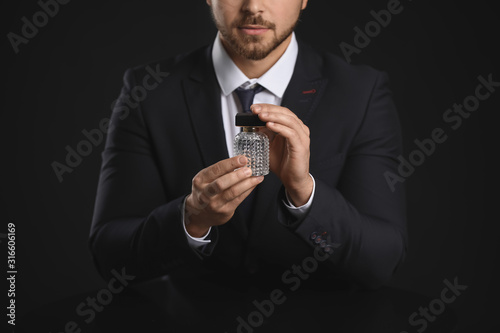 Handsome young man with bot...