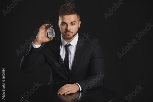 Handsome young man with bot...