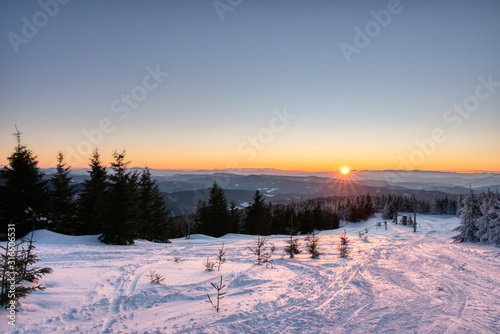 Winter landscape with a mountain forest. Sunset in the mountain valley. czech beskydy