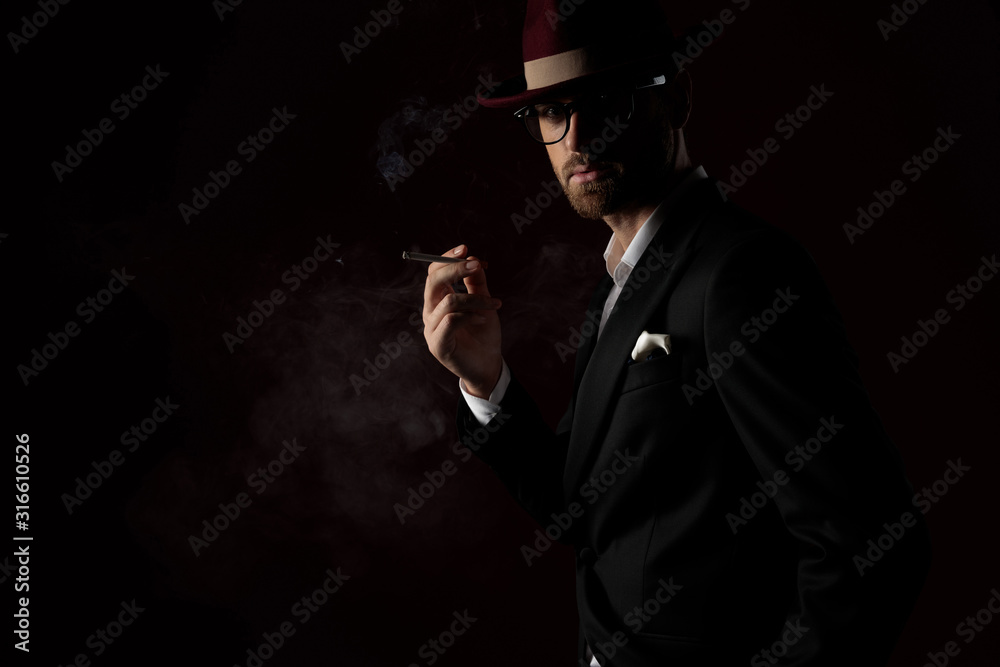 Mysterious fashion model smoking a cigarette Mysterious fashion model smoking a cigarette