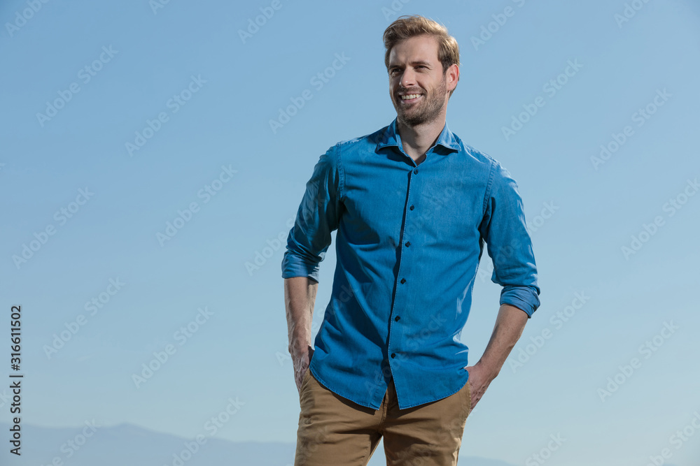 casual man standing and feeling good in his skin casual man standing and feeling good in his skin