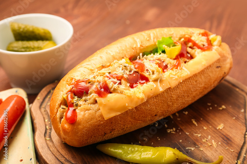 Tasty hot dog on table
