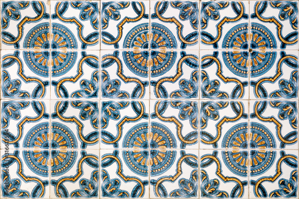 Traditional Portuguese tiles of Azulejo. Background of antique square painted clay tiles to illustrate handmade, tourism, travel.