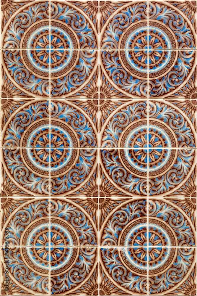 Traditional Portuguese tiles of Azulejo. Background of antique square painted clay tiles to illustrate handmade, tourism, travel.