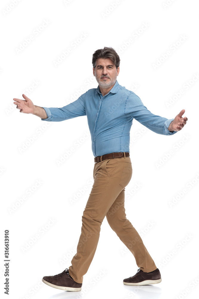 Side view of a positive casual man greeting Side view of a positive casual man greeting