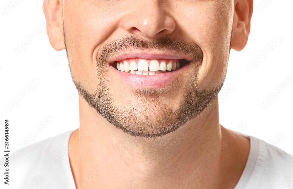 Handsome man with healthy teeth on white background, closeup Handsome man with healthy teeth on white background, closeup