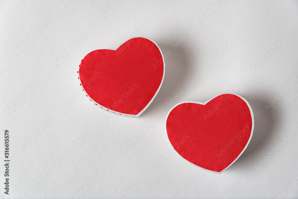 Two red heart shaped box on the white background. Copy space. Directly above. Valentine's day