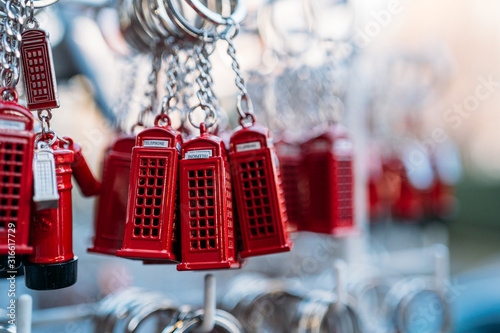 Photography Sale of many key chains of the typical london red phone booth in a street market