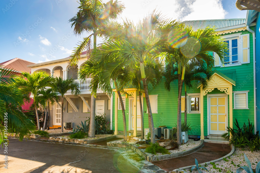 Fototapeta premium Colorful houses in Orient Bay on the island of Saint-Martin in the Caribbean