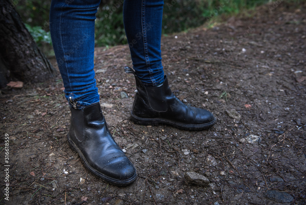 legs of a girl with boots on a forest legs of a girl with boots on a forest