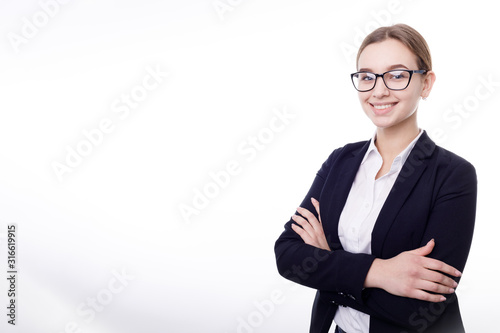 Young smiling female office employee posing with her arms crossed isolated white background copyspace