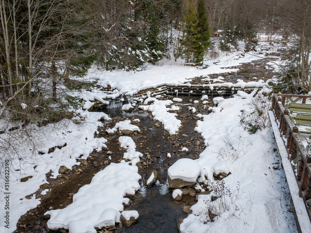 Fototapeta premium river in winter Carpathians