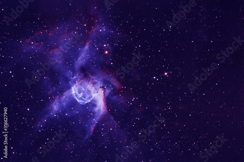 A blue nebula with many stars  and galaxies. Elements of this image were furnished by NASA
