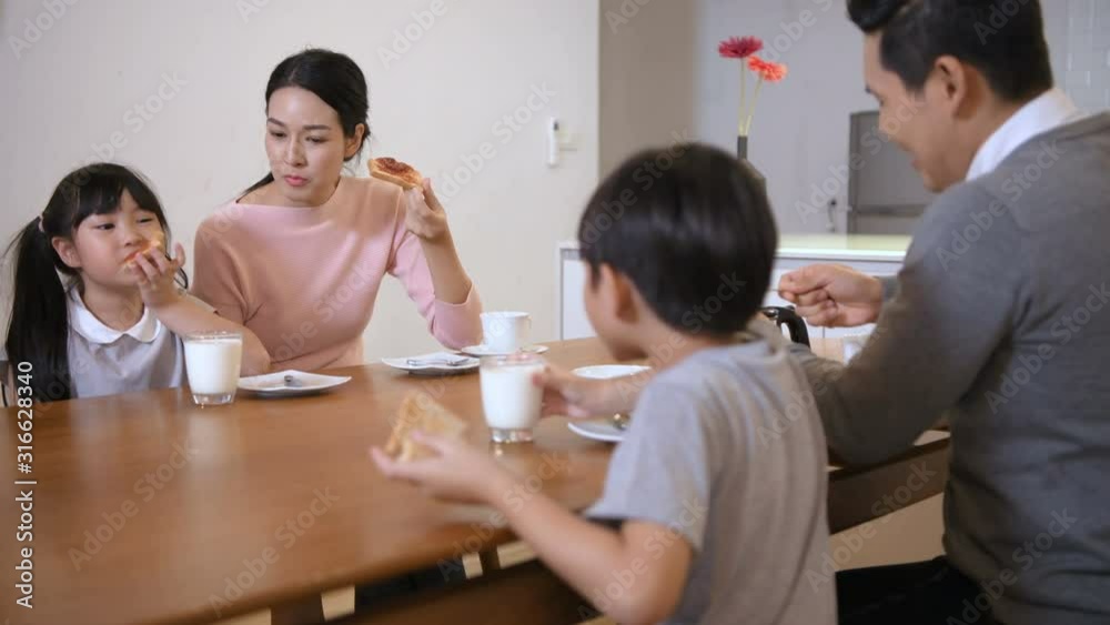 Holiday concept. Family eating breakfast together in the kitchen. 4k Resolution. Holiday concept. Family eating breakfast together in the kitchen. 4k Resolution.