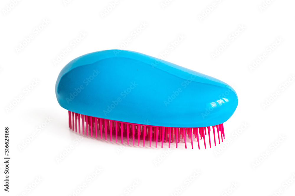 Blue massage brush with red prongs Blue massage brush with red prongs