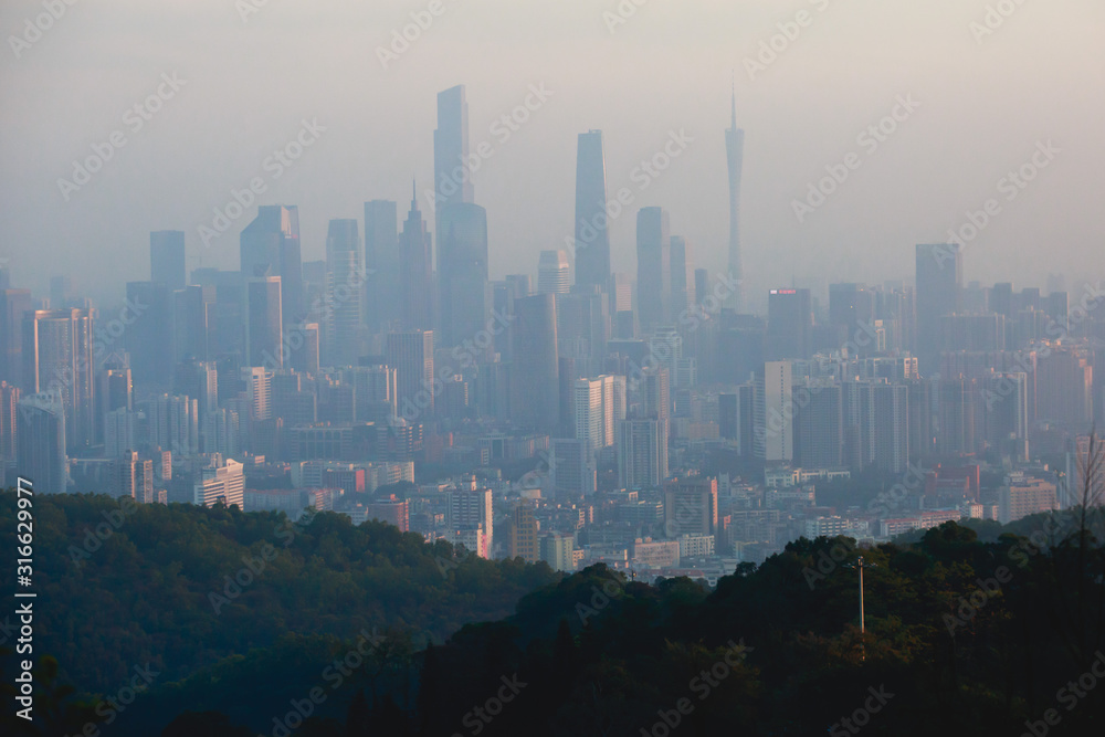 View of Guangzhou city with Zhujiang New Town from White Cloud Mountain, Baiyun Mountain, Guandong, China, sunny summer day View of Guangzhou city with Zhujiang New Town from White Cloud Mountain, Baiyun Mountain, Guandong, China, sunny summer day