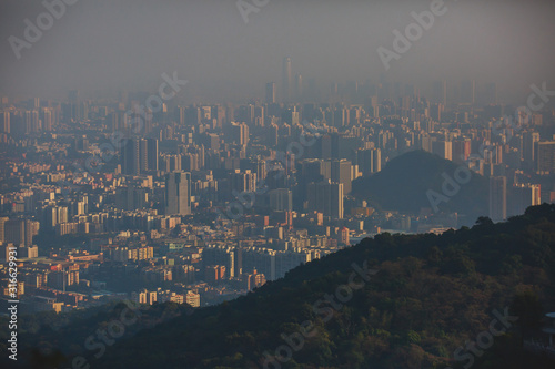 View of Guangzhou city with Zhujiang New Town from White Cloud Mountain, Baiyun Mountain, Guandong, China, sunny summer day photo