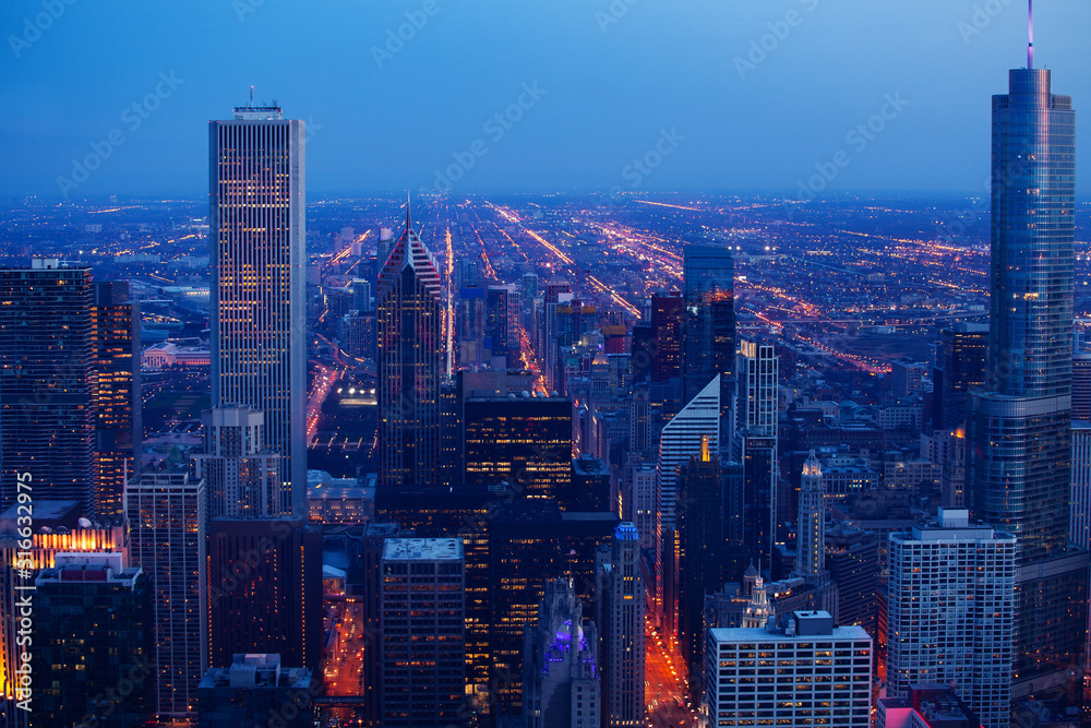 Chicago downtown evening dark time cityscape wide panorama, aerial or bird-eyes view Illinois, USA.