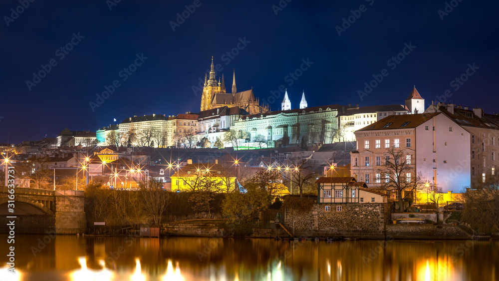 Night View Across the River on Illuminated Prague Castle, Tourist Destination in Capital City of Czech Republic