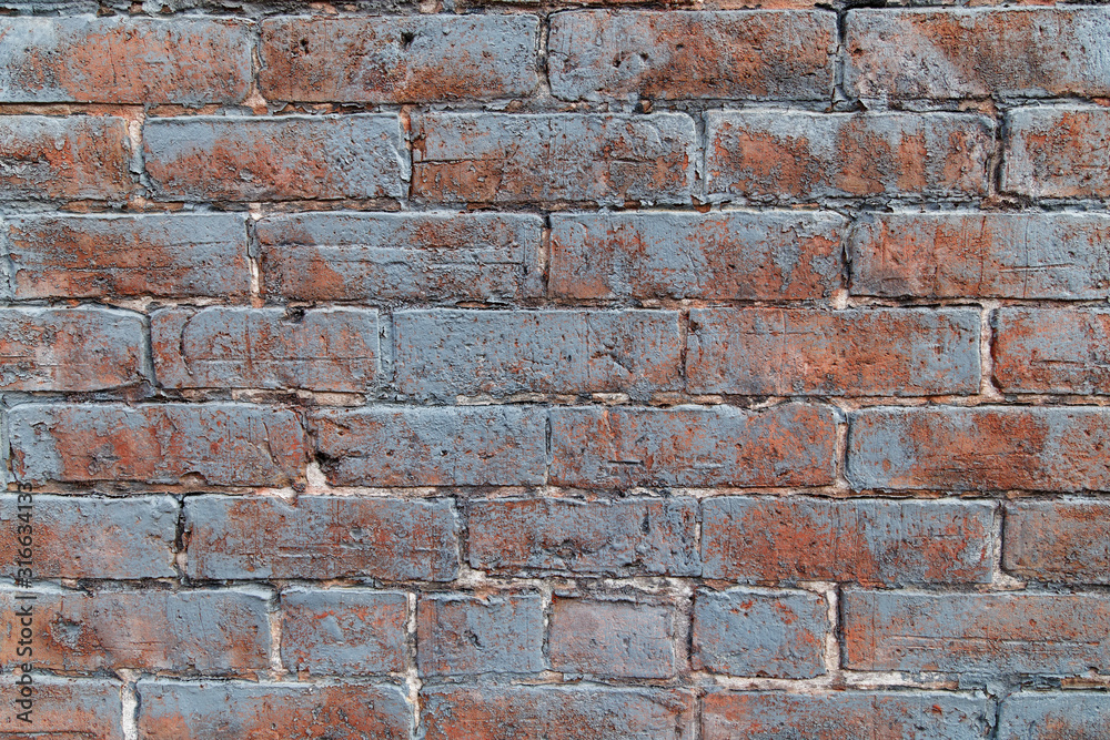 Naklejka premium Very old brick wall with chipped paint. XXXL with incredible texture.