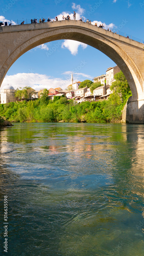 Mostar, Bosnia and Herzegovina, April 2019: Old bridge and Neretva River. 