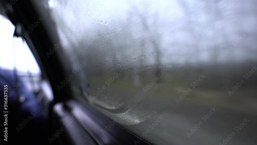 Fog. The car rides at speed on the road in thick fog in the morning. Limited visibility for the driver. Dangerous traffic. Autumn weather. Driving on a foggy road out of town. Fog. The car rides at speed on the road in thick fog in the morning. Limited visibility for the driver. Dangerous traffic. Autumn weather. Driving on a foggy road out of town.
