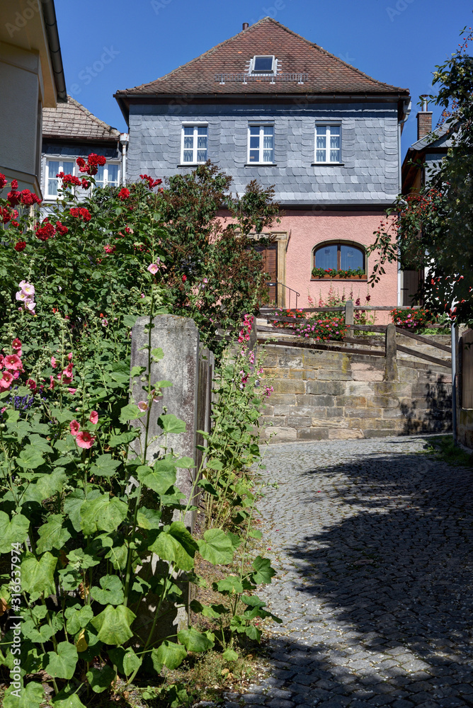 old house with flowers in Thurnau