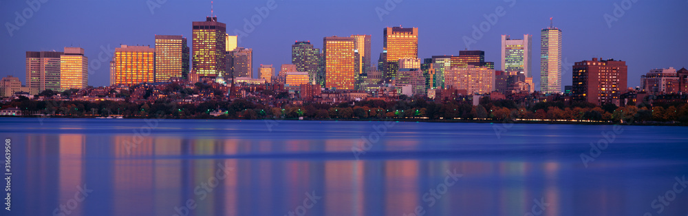 This is the State Capitol and skyline along the Charles River. It is the view from Harvard Bridge at sunset.