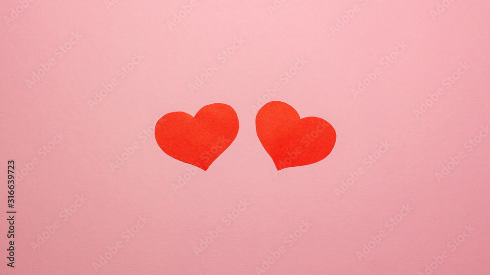 Two red hearts on pink background. Valentines day concept. Flat lay top view