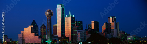 This is the skyline at dusk. It shows the Reunion Tower which is 50 stories high. photo