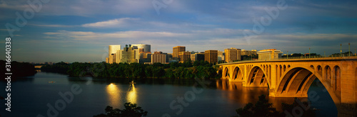 This shows sunrise over the Key Bridge on the Potomac River. The skyline of Rosslyn, Virginia is in the background. photo
