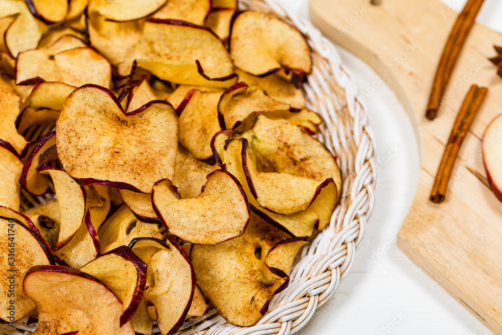 Baked Cinnamon Red Apple Chips. Selective focus.