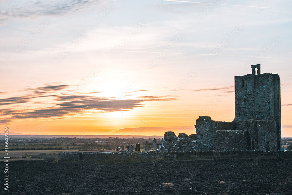 A Medieval Church At Sunset.