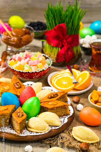 Novruz Ramadan in Azerbaijan. Colored Eggs, Wheat Springs for Easter and Traditional Sweets. Selective focus.