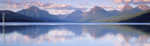 This is Lake McDonald. The surrounding mountains are reflected in the lake. photo