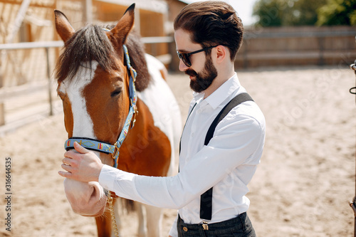 Horse theme. Businessman with a horse. Man in a white shirt