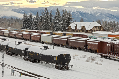 Wallpaper Mural rail yard in winter with trains, depot, and mountains in background, whitefish, montana Torontodigital.ca