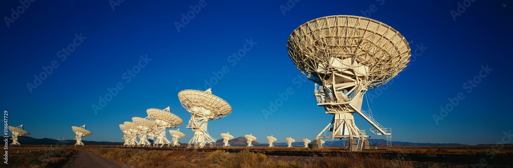 This is the Very Large Array or VLA at the National Radio Astronomy Observatory. It represents communication.
