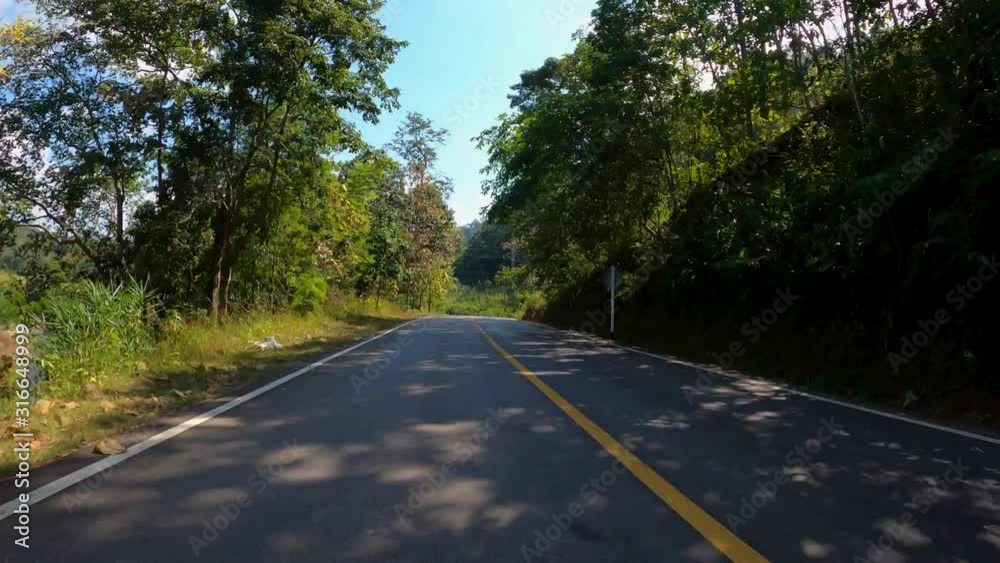 Time-lapse journey on the countryside road fast movement speed in the rural place with wood and forest Time-lapse journey on the countryside road fast movement speed in the rural place with wood and forest