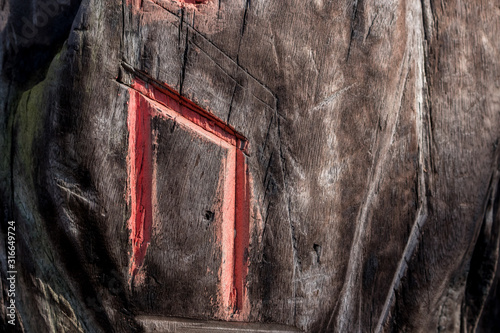 Fotografie Slavic pagan esoteric symbols (runes) are carved on a wooden surface