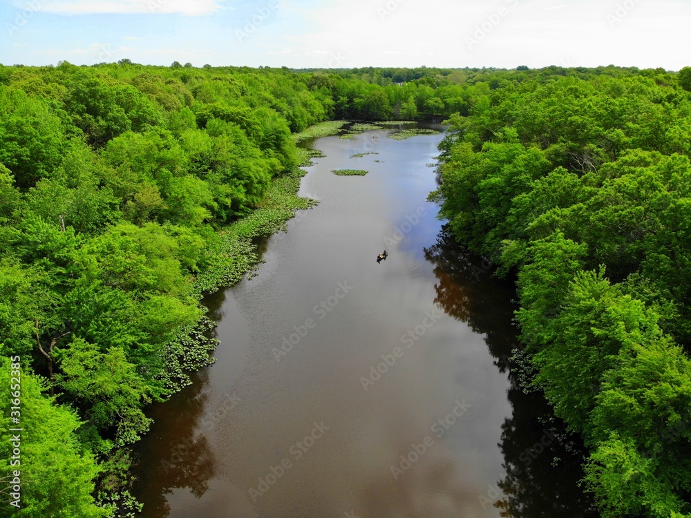 The aerial view of the green trees and water along Becks Pond, Newark, Delaware, U.S.A