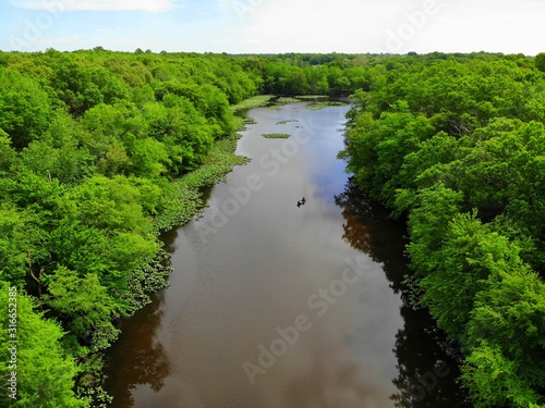 The aerial view of the green trees and water along Becks Pond, Newark, Delaware, U.S.A