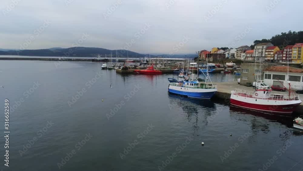 Landscape of Camarinas cityscape, Spain with seagulls and marina in forefront Landscape of Camarinas cityscape, Spain with seagulls and marina in forefront