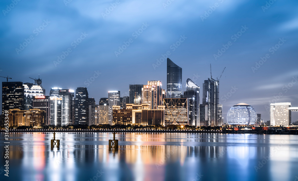 Night view of architectural landscape and urban skyline in Hangzhou Financial District..