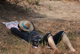 Agriculturist male use the loincloth on the floor for relax sleeping with hat close the face on nature.