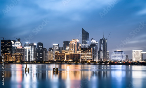 Night view of architectural landscape and urban skyline in Hangzhou Financial District..