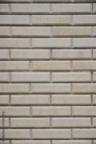 gray yellow brick wall background in outside, vertical stock photo image