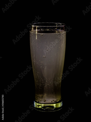 Fresh and cold drink isolated on black background